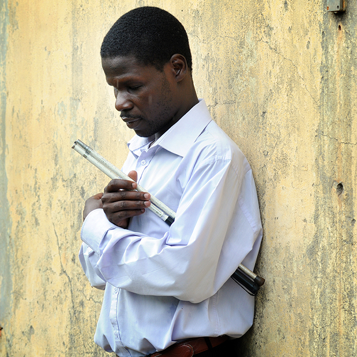 Man leaning on a wall