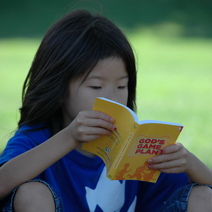 Child reading a Bible