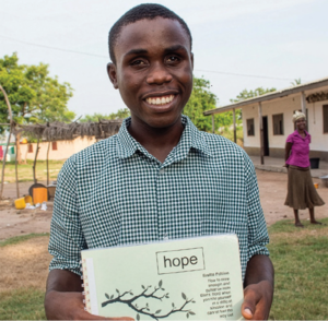 A boy with Braille Bible