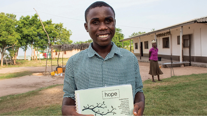 A boy with Braille Bible